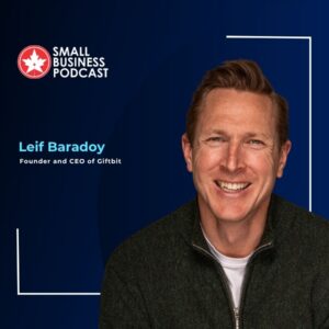 Portrait of Leif Baradoy, founder and CEO of Giftbit, smiling against a dark blue Small Business Podcast backdrop with logo and geometric frames, left-aligned text.